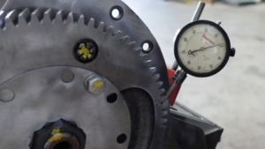 Technician Uses A Starrett Dial Sensor To Measure The Backlash Between The Gears
